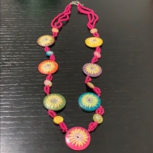 Necklace made of pink beads and colorful flowers